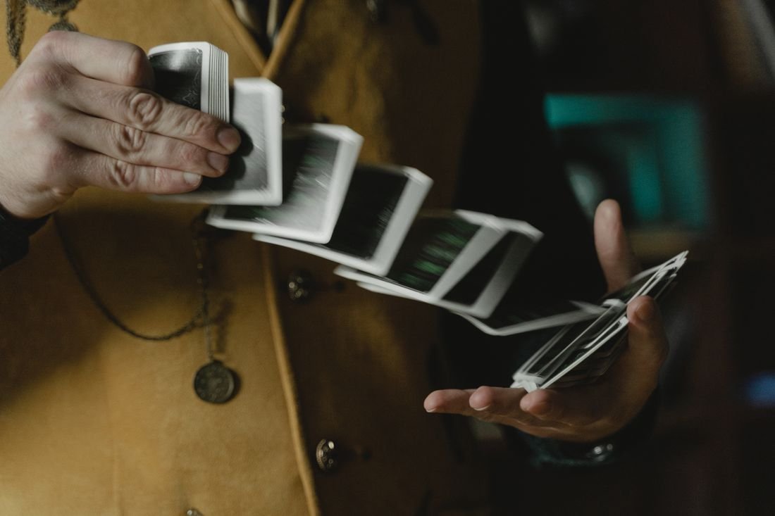 Close-up of hands springing a deck of playing cards