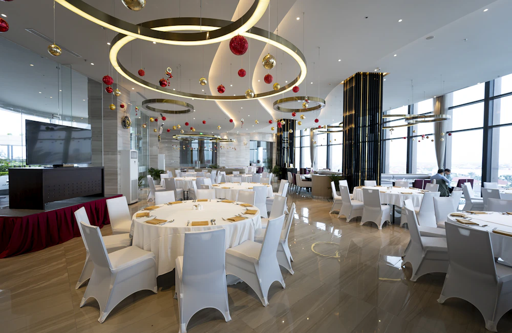 A reception room with tables and open space for guests to mingle